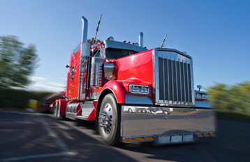 A red 18wheeler that's shining after a cleaning